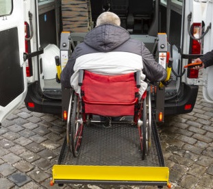 man on a wheelchair entering a van